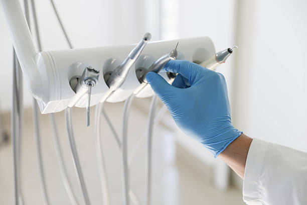 Professional Tooth Extraction technician working in Rockford, IL